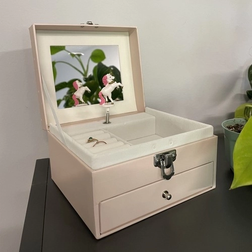 Cutie muzicală cu unicorn rotativ
