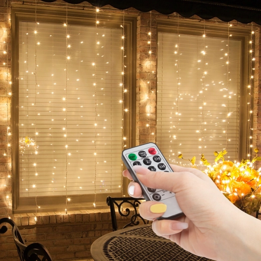 Perdea luminoasă cu 100 de LED-uri alb cald și telecomandă