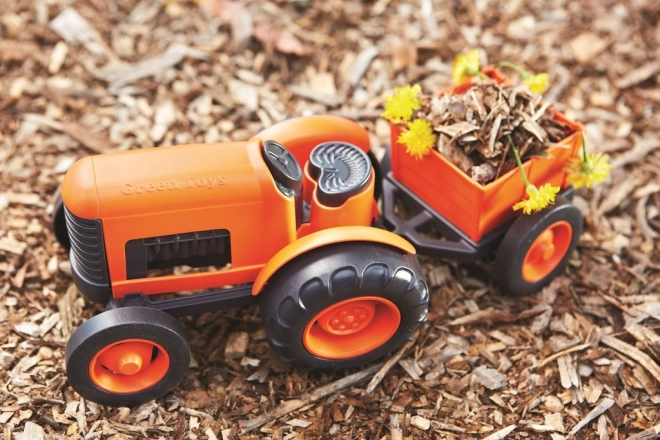 Tractor cu remorcă portocaliu de la Green Toys